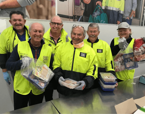 rotarians with food hampers