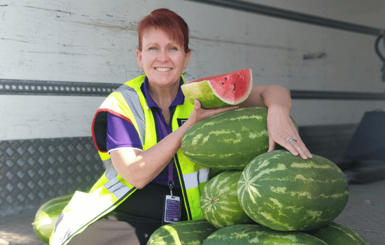 Kate holding the food donated watermelons
